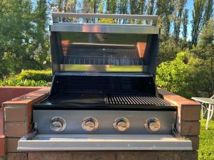 a grill sitting on top of a patio at Riverbank Park MOTEL in Bright