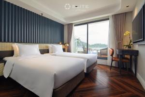Postel nebo postele na pokoji v ubytování Elite of the Seas