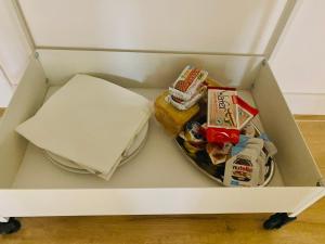 a box with food and other items in it at B&B JOIS in Bologna