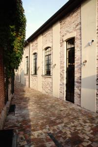 a brick building with a cobblestone alley at Hotel Livnica in Belgrade