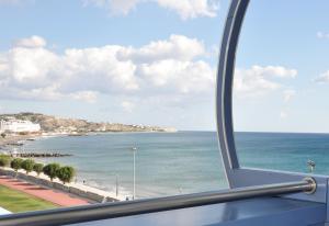 a view of the ocean from a train window at Astron Hotel in Ierapetra
