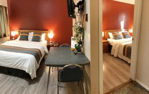 Postelja oz. postelje v sobi nastanitve Duncan Motel