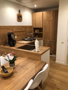 a kitchen with a wooden counter top with a sink at Ferienwohnung Giese in Bleckede