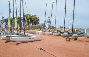 a row of sailboats are lined up on a beach at Holiday Home Rue Jarl Priel in Plouguiel +24 photos