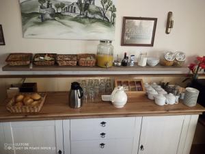 a kitchen counter with food on a wooden counter top at Gasthof Happe in Harth