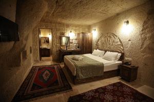 Postel nebo postele na pokoji v ubytování Nox Cave Hotel Special Class