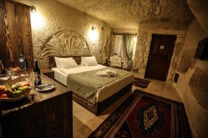 Postel nebo postele na pokoji v ubytování Nox Cave Hotel Special Class