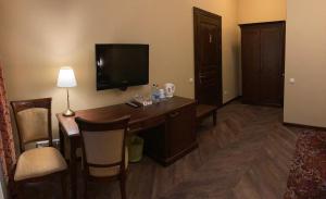 TV a/nebo společenská místnost v ubytování Guest House Pirklių Namai
