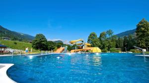 a water park with a water slide and slides at Pension Stüttler in Schruns