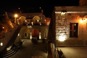 a view of a building at night with lights at Nox Cave Hotel in Nevşehir