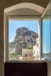 a window with a view of a mountain at PIANELLE RESORT in Matera