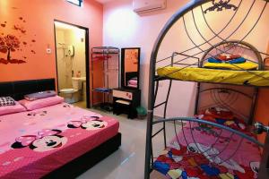 a bedroom with two bunk beds and a mirror at 46 Jb Tmn Century 5Room 18pax near CIQ KSL Mall in Johor Bahru