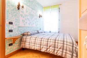 Postel nebo postele na pokoji v ubytování Patrioti 51 - Asiago Centro + 3 fotografie