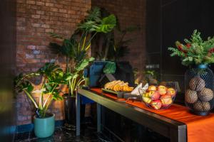 a table with a bunch of food on it at fyn park hotel in Makkasan