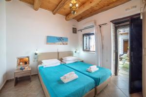 Postel nebo postele na pokoji v ubytování GrapeVine Villa + 14 fotografií