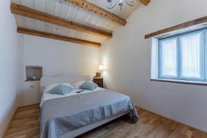 Posteľ alebo postele v izbe v ubytovaní House Grandići 1852