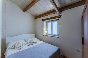 Posteľ alebo postele v izbe v ubytovaní House Grandići 1852