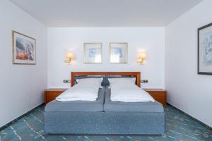 Postel nebo postele na pokoji v ubytování Hotel Wittekindsquelle + 37 fotografií