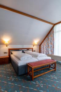 Postel nebo postele na pokoji v ubytování Hotel Wittekindsquelle