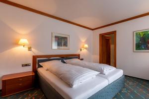 Postel nebo postele na pokoji v ubytování Hotel Wittekindsquelle
