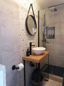 a bathroom with a sink and a mirror and a shower at Villa Otivar - Rio Verde in Otívar +31 photos