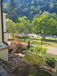 a view of a garden from the balcony of a house at OSCARS Hotel 1415 in Bad Liebenzell