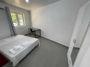 Ένα ή περισσότερα κρεβάτια σε δωμάτιο στο Maison de Bourda