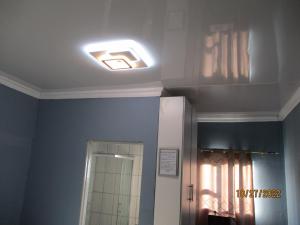 a bathroom with a light on the ceiling at PS GOOD TIME GUEST HOUSE in Klerksdorp