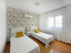 Posteľ alebo postele v izbe v ubytovaní Villa Charlotte