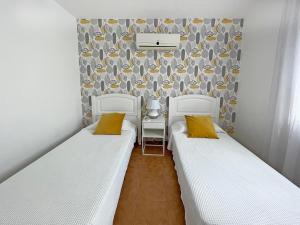 Posteľ alebo postele v izbe v ubytovaní Villa Charlotte