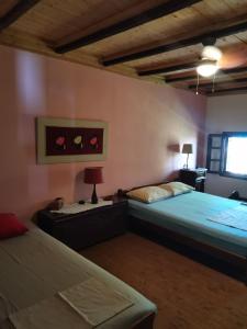 Ένα ή περισσότερα κρεβάτια σε δωμάτιο στο Montesantos Mansion, Panteleimonas