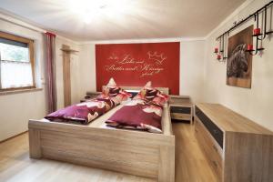 a bedroom with a bed and a desk in it at Haus Tobias in Bad Füssing