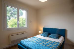 Postel nebo postele na pokoji v ubytování Appartement avec piscine + 34 fotografií