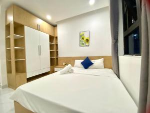 Giường trong phòng chung tại Mường Thanh DaNang SeaView Apartment