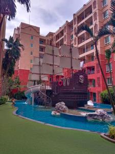 a pirate ship water slide in front of a building at Seven Seas Condo Resort Jomtien in Jomtien Beach +102 photos