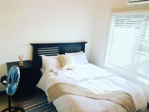 Ένα ή περισσότερα κρεβάτια σε δωμάτιο στο Cozy Corner Guesthouse