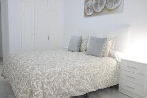 Postel nebo postele na pokoji v ubytování Apartamento Playa Velilla Park II