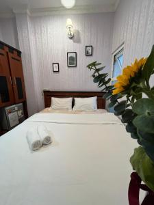 Letto o letti in una camera di Dang Uyen 1 Hotel