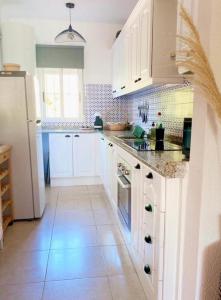 Kuchyňa alebo kuchynka v ubytovaní Casa de amigos Lomas Del Golf, Orihuela Costa
