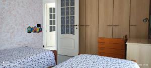 Postel nebo postele na pokoji v ubytování DA U BACCI - LOANO + 4 fotografie