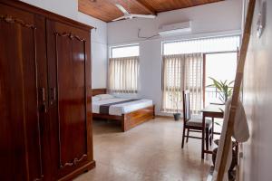 Rúm í herbergi á Greenscape Colombo