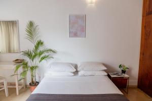 Rúm í herbergi á Greenscape Colombo