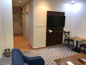 Μια τηλεόραση ή/και κέντρο ψυχαγωγίας στο Quel Serviced Units