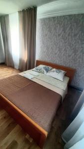 Postel nebo postele na pokoji v ubytování Guest House - Гостевой частный дом