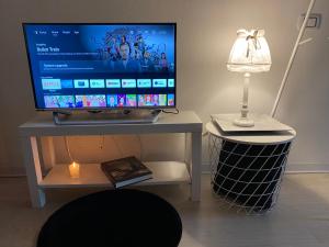 TV a/nebo společenská místnost v ubytování Dependance