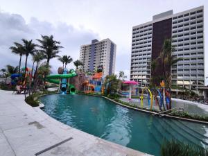 a pool with a water park with a water slide at Ap particular 1001 ou 1201 no Salinas Premium Resort in Salinópolis
