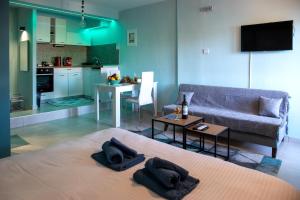 a living room with a couch and a table at The North Apartment in Kastoria