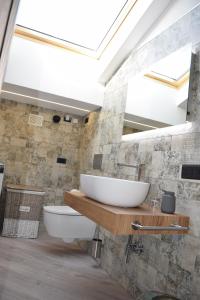 a bathroom with a large sink and a mirror at Baita Valtellina. Relax nel cuore delle Alpi in Grosio +110 photos