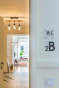 an open door to a hallway with a living room at Welcome Aliados a Noble apartment in City Heart in Porto