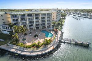 an aerial view of a hotel next to a body of water at Oceanfront Luxury Condo! Mins to beach! Rum Bar Next Door! in St Petersburg
